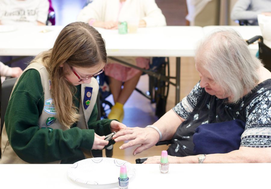 Girl Scouts treat residents to manicures